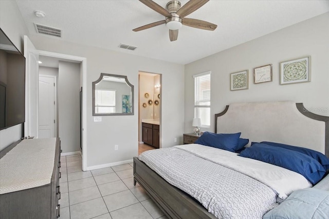 914 Fallon Hills Dr, Haines City, FL 33844 - bedroom featuring baseboards, light tile patterned floors, ceiling fan, and connected bathroom