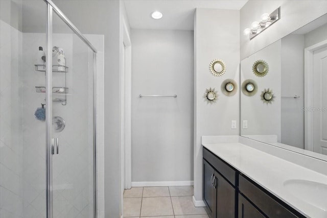 914 Fallon Hills Dr, Haines City, FL 33844 - full bath with a shower stall, tile patterned floors, vanity, and baseboards