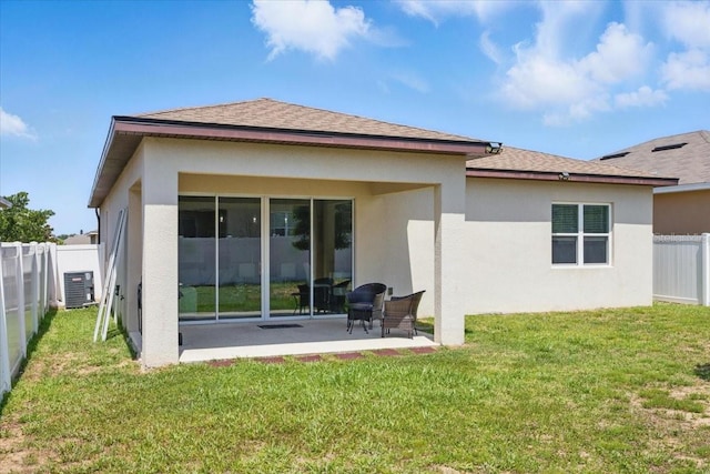 914 Fallon Hills Dr, Haines City, FL 33844 - rear view of house with stucco siding, a patio, a shingled roof, and central air condition unit