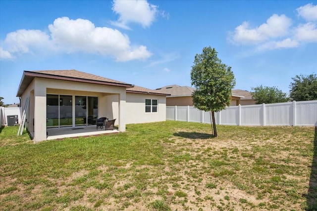 914 Fallon Hills Dr, Haines City, FL 33844 - back of house featuring stucco siding and central air condition unit