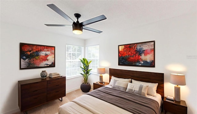 10747 Satinwood Cir, Orlando, FL 32825 - bedroom with baseboards, ceiling fan, and light colored carpet