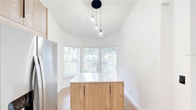 10747 Satinwood Cir, Orlando, FL 32825 - kitchen with stainless steel refrigerator with ice dispenser, light brown cabinetry, modern cabinets, and light wood-style floors