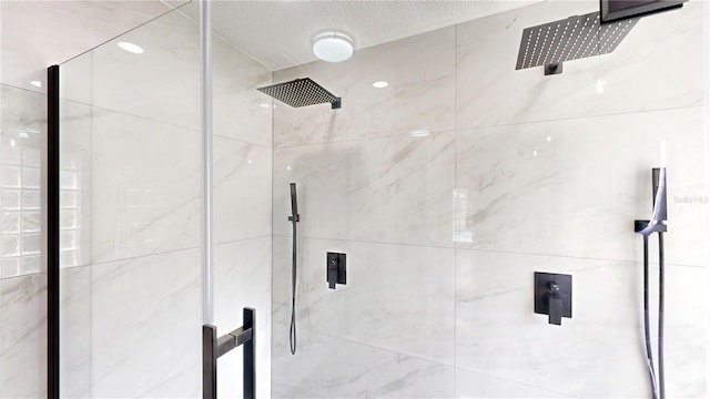 10747 Satinwood Cir, Orlando, FL 32825 - bathroom with a shower stall and a textured ceiling