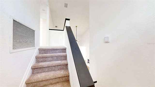 10747 Satinwood Cir, Orlando, FL 32825 - stairway featuring baseboards and carpet floors