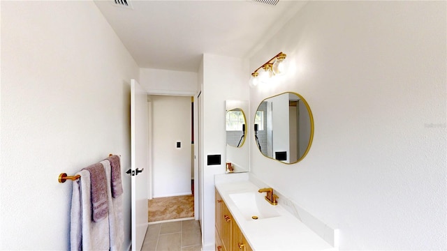 10747 Satinwood Cir, Orlando, FL 32825 - bathroom with vanity and tile patterned flooring