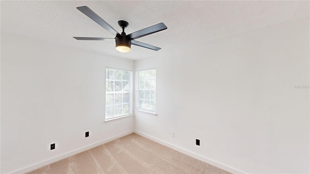 10747 Satinwood Cir, Orlando, FL 32825 - unfurnished room with ceiling fan, baseboards, a textured ceiling, and light colored carpet