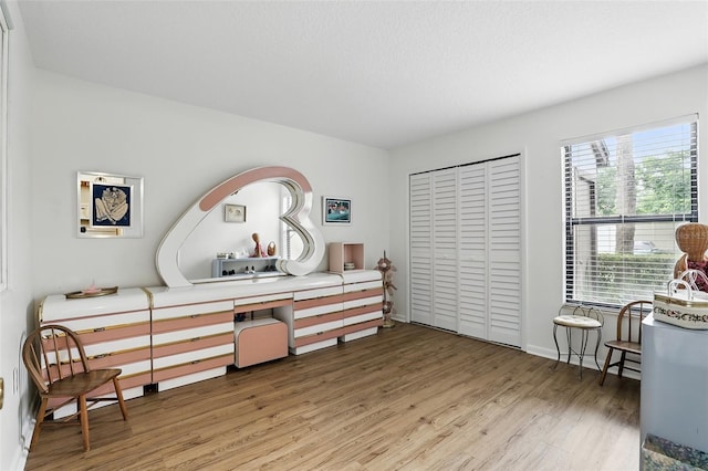 3012 S Semoran Blvd Unit S, Orlando, FL 32822 - living area featuring wood finished floors and a desk