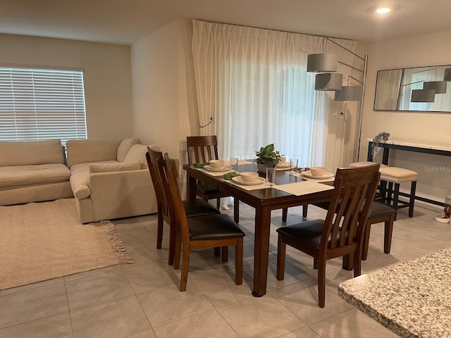 7172 SW 135th Pl, Ocala, FL 34473 - dining room with healthy amount of natural light and light tile patterned flooring