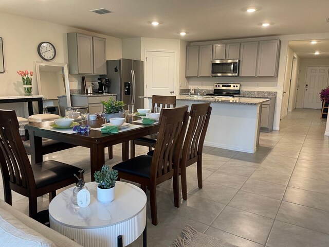 7172 SW 135th Pl, Ocala, FL 34473 - dining area featuring light tile patterned floors and recessed lighting