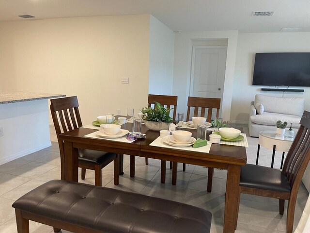7172 SW 135th Pl, Ocala, FL 34473 - dining area with baseboards and light tile patterned floors