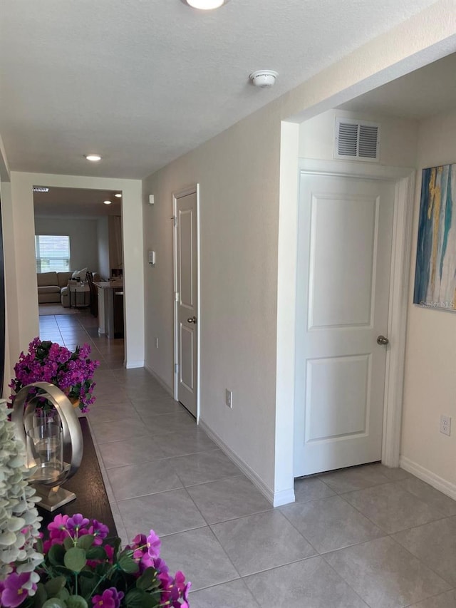 7172 SW 135th Pl, Ocala, FL 34473 - hallway with light tile patterned floors and recessed lighting
