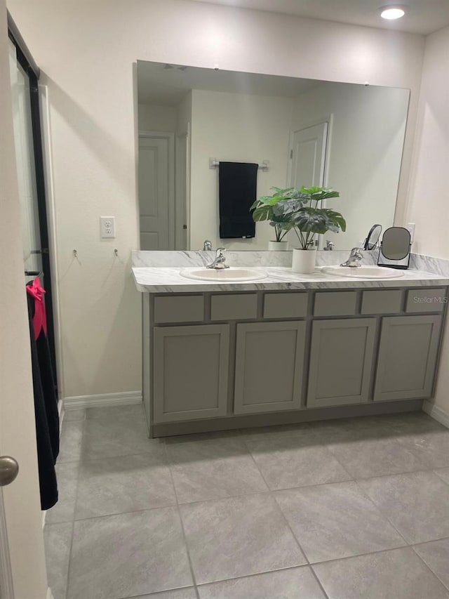 7172 SW 135th Pl, Ocala, FL 34473 - bathroom with double vanity and tile patterned flooring