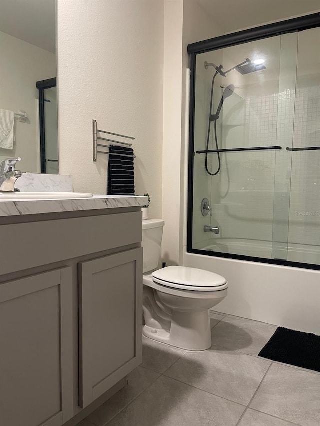 7172 SW 135th Pl, Ocala, FL 34473 - bathroom with tile patterned flooring, combined bath / shower with glass door, and vanity