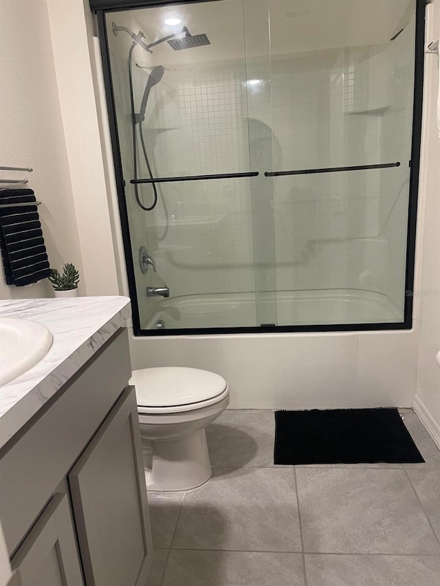 7172 SW 135th Pl, Ocala, FL 34473 - bathroom with tile patterned flooring, vanity, and bath / shower combo with glass door