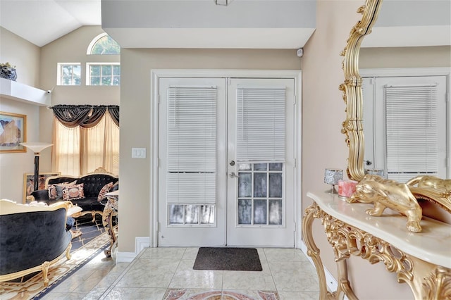 2971 Cayman Way, Orlando, FL 32812 - foyer with french doors, lofted ceiling, baseboards, and light tile patterned flooring