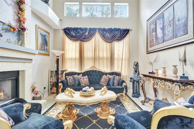 2971 Cayman Way, Orlando, FL 32812 - living area with a lit fireplace, a high ceiling, and baseboards