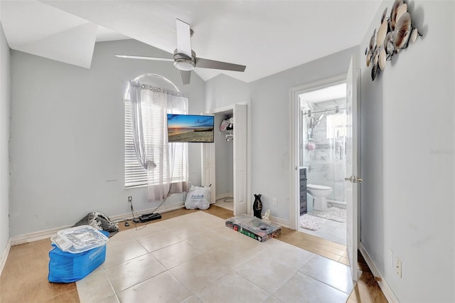 2971 Cayman Way, Orlando, FL 32812 - unfurnished bedroom with multiple windows, tile patterned flooring, lofted ceiling, and ensuite bathroom