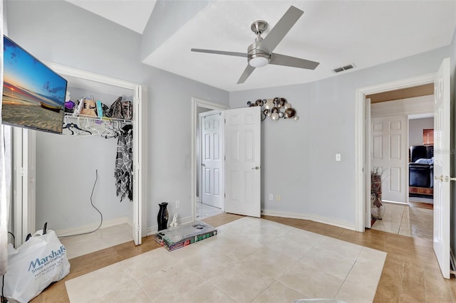 2971 Cayman Way, Orlando, FL 32812 - unfurnished bedroom featuring a closet, a ceiling fan, light tile patterned floors, and baseboards