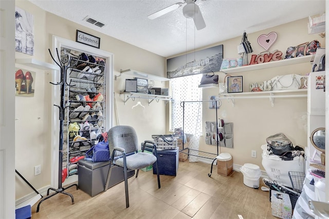 2971 Cayman Way, Orlando, FL 32812 - sitting room with ceiling fan and a textured ceiling