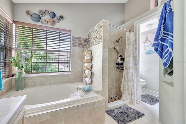 2971 Cayman Way, Orlando, FL 32812 - full bath with a bath, tile patterned floors, a tile shower, and toilet