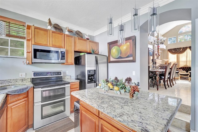 2971 Cayman Way, Orlando, FL 32812 - kitchen with stainless steel appliances, a chandelier, light stone counters, a textured ceiling, and light tile patterned floors