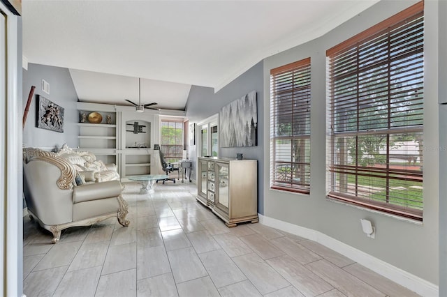 2971 Cayman Way, Orlando, FL 32812 - living room with a ceiling fan, lofted ceiling, and baseboards