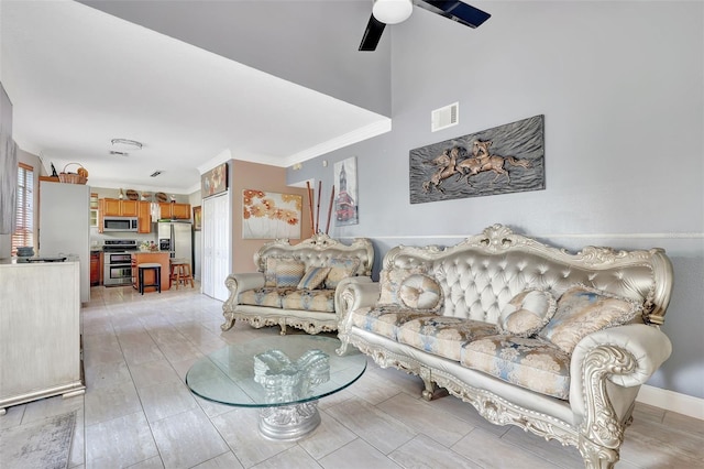 2971 Cayman Way, Orlando, FL 32812 - living room with a ceiling fan and crown molding