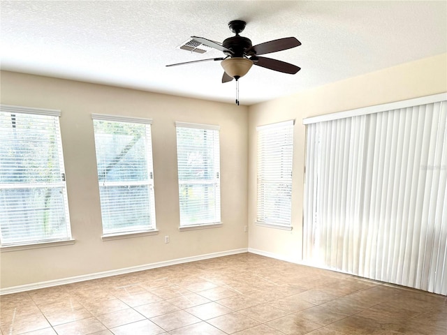 1016 Fountain Coin Loop, Orlando, FL 32828 - tiled empty room with a ceiling fan and a textured ceiling