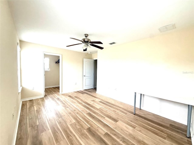 1016 Fountain Coin Loop, Orlando, FL 32828 - spare room with light wood-type flooring and a ceiling fan