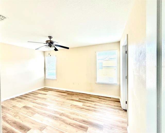 1016 Fountain Coin Loop, Orlando, FL 32828 - empty room featuring light wood-type flooring and ceiling fan