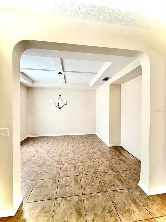 1016 Fountain Coin Loop, Orlando, FL 32828 - tiled spare room featuring arched walkways and coffered ceiling