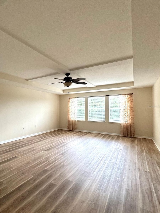 1016 Fountain Coin Loop, Orlando, FL 32828 - empty room with wood finished floors and a ceiling fan