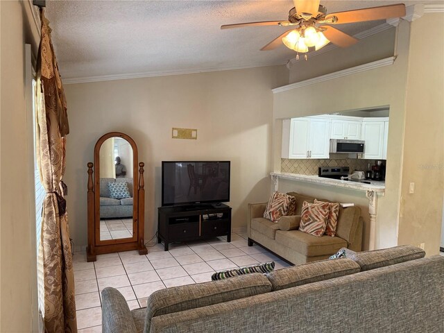7104 Blue Earth Ct, Orlando, FL 32818 - living area with light tile patterned floors, crown molding, and ceiling fan