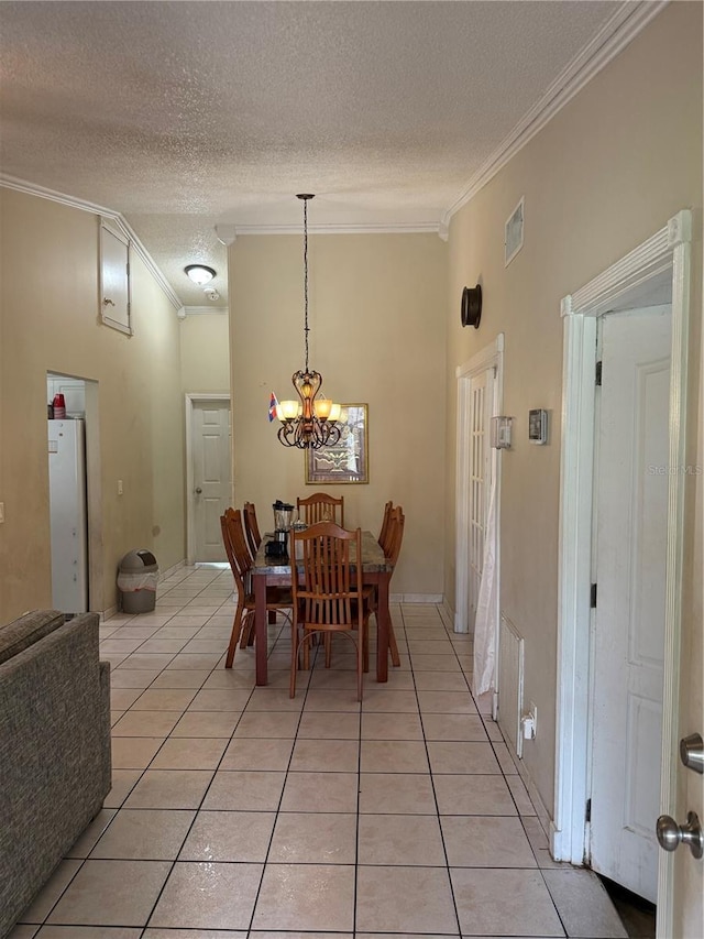 7104 Blue Earth Ct, Orlando, FL 32818 - dining space with crown molding, light tile patterned floors, a textured ceiling, and a chandelier