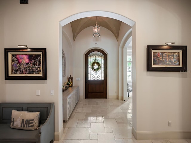 11106 Coniston Way, Windermere, FL 34786 - foyer with arched walkways, stone tile flooring, and baseboards