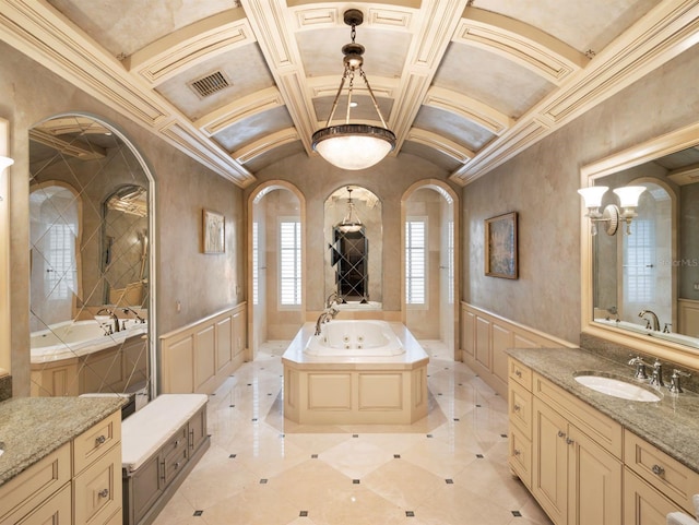 11106 Coniston Way, Windermere, FL 34786 - full bathroom with coffered ceiling, a whirlpool tub, two vanities, a wainscoted wall, and a decorative wall