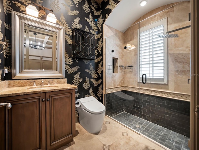 11106 Coniston Way, Windermere, FL 34786 - bathroom featuring a shower stall, vanity, toilet, wallpapered walls, and vaulted ceiling
