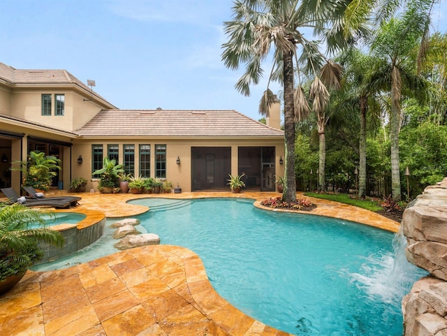 11106 Coniston Way, Windermere, FL 34786 - view of pool with a pool with connected hot tub, a patio area, and a sunroom