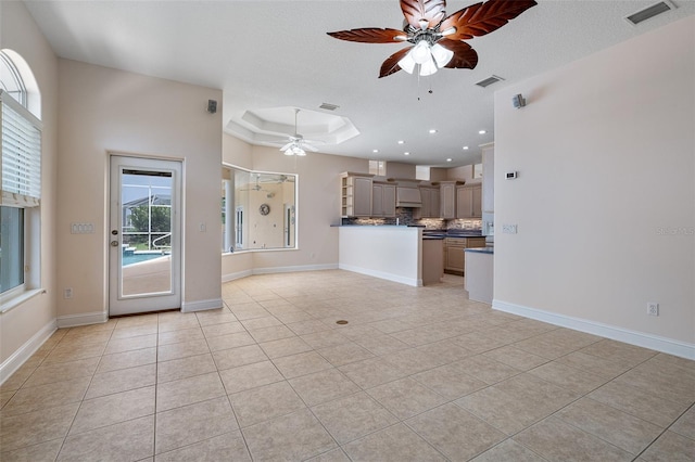 5 Florence Ct, Palm Coast, FL 32137 - unfurnished living room with ceiling fan, light tile patterned floors, recessed lighting, baseboards, and a raised ceiling
