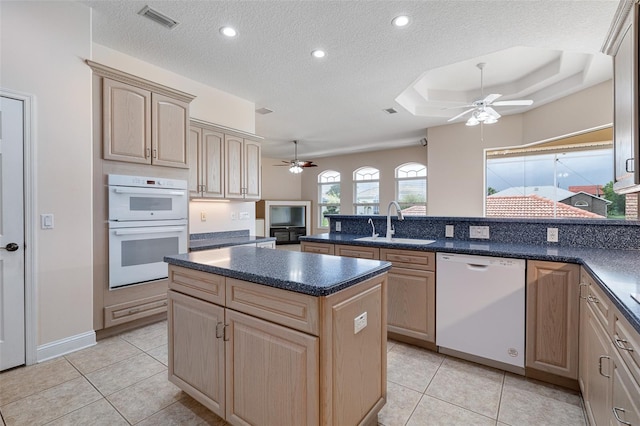 5 Florence Ct, Palm Coast, FL 32137 - kitchen featuring white appliances, a sink, ceiling fan, a peninsula, and a textured ceiling