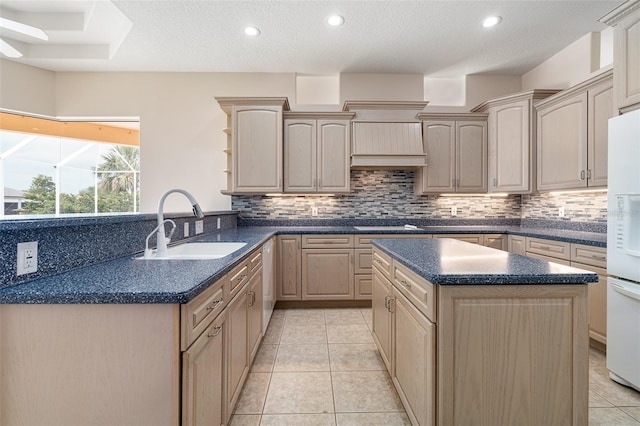 5 Florence Ct, Palm Coast, FL 32137 - kitchen with a sink, freestanding refrigerator, tasteful backsplash, dark countertops, and recessed lighting