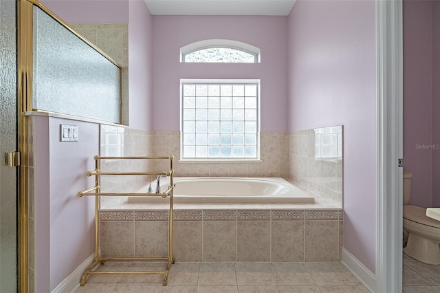 5 Florence Ct, Palm Coast, FL 32137 - bathroom with toilet, a garden tub, tile patterned flooring, and a shower stall