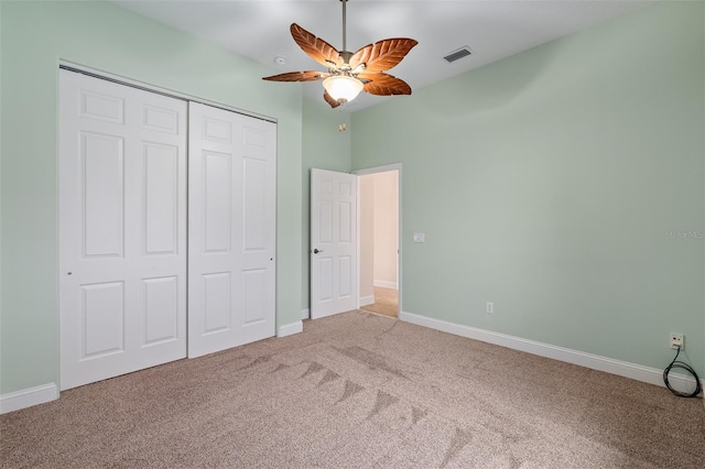 5 Florence Ct, Palm Coast, FL 32137 - unfurnished bedroom featuring carpet floors, a closet, baseboards, and a ceiling fan