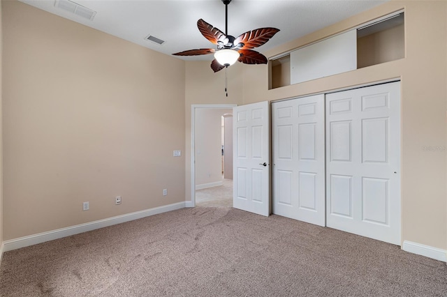 5 Florence Ct, Palm Coast, FL 32137 - unfurnished bedroom featuring carpet flooring, baseboards, a closet, and a ceiling fan