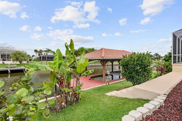 5 Florence Ct, Palm Coast, FL 32137 - view of grassy yard with a water view, boat lift, and a boat dock