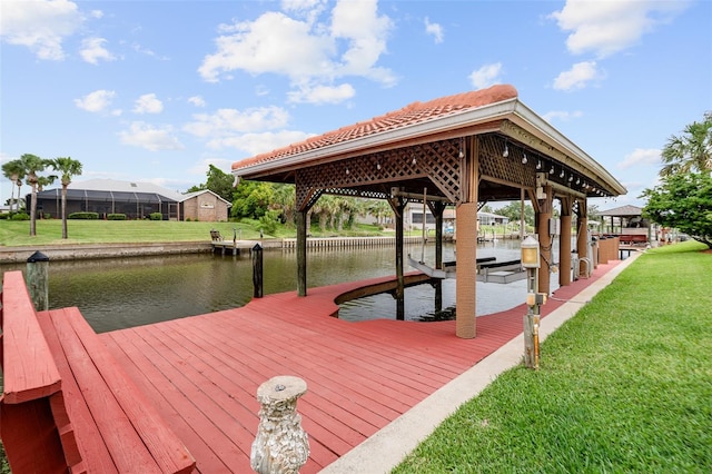 5 Florence Ct, Palm Coast, FL 32137 - dock area with a water view, boat lift, and a lawn
