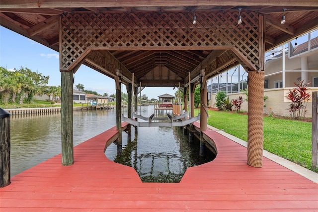 5 Florence Ct, Palm Coast, FL 32137 - dock area featuring a water view, boat lift, and a yard