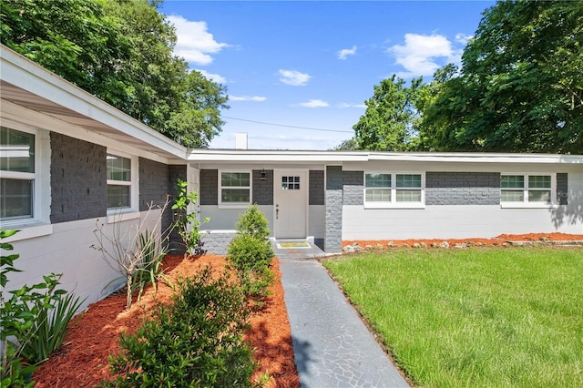 3251 Wickersham Ct, Orlando, FL 32806 - single story home featuring a front lawn and concrete block siding