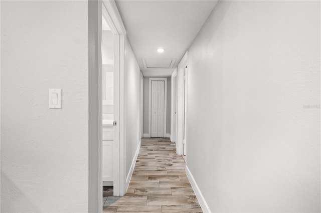 3251 Wickersham Ct, Orlando, FL 32806 - hallway featuring attic access, light wood finished floors, and recessed lighting