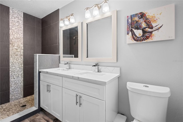 3251 Wickersham Ct, Orlando, FL 32806 - full bath with a tile shower, double vanity, and wood finished floors